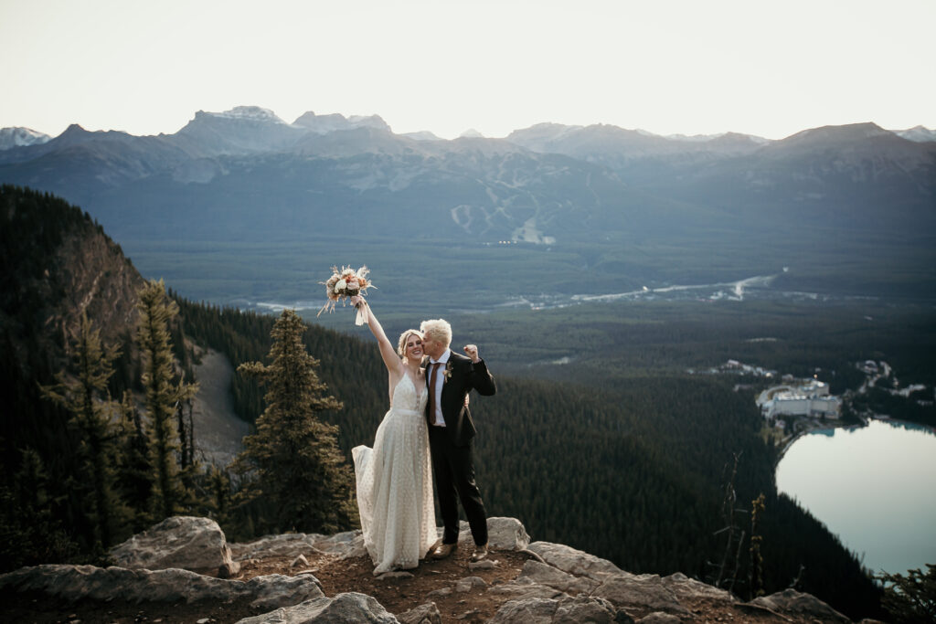 Adventurous elopement ceremony photo of a happy bride and groom