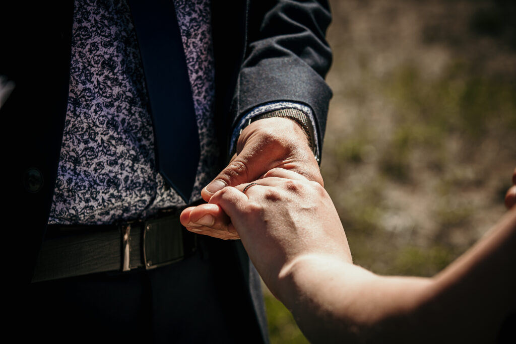 Bride and groom exchanging rings during their Alberta elopement