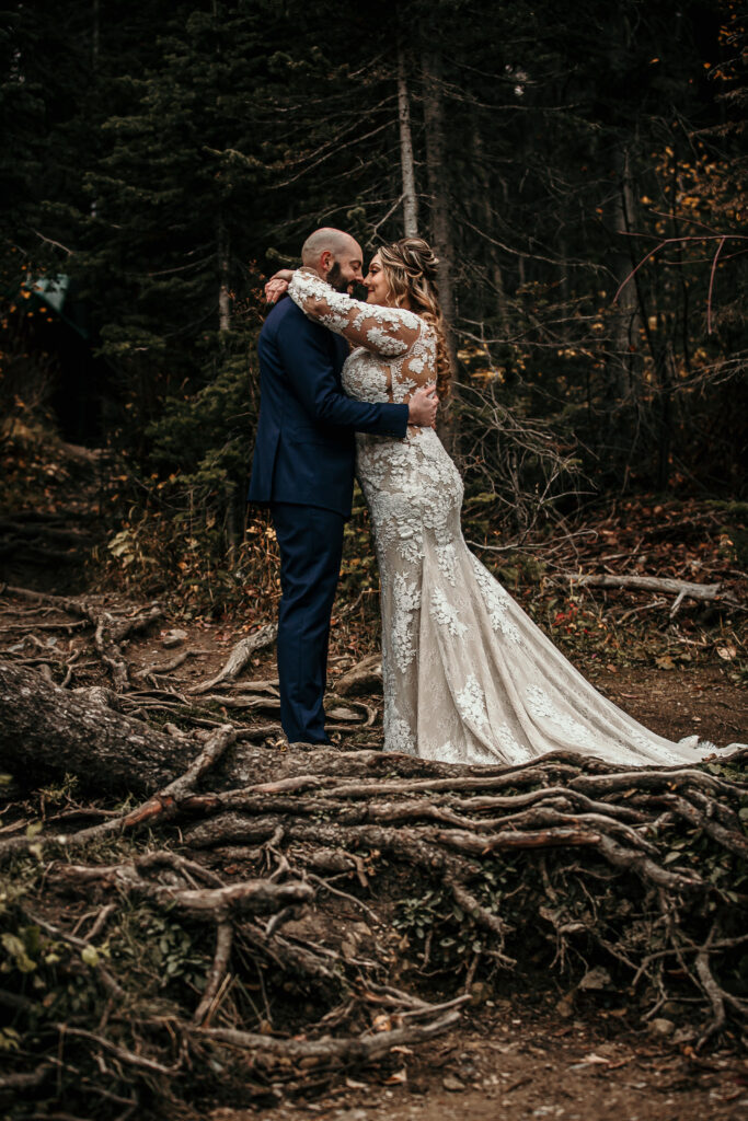Bride and groom first dance in the forest for Alberta elopement