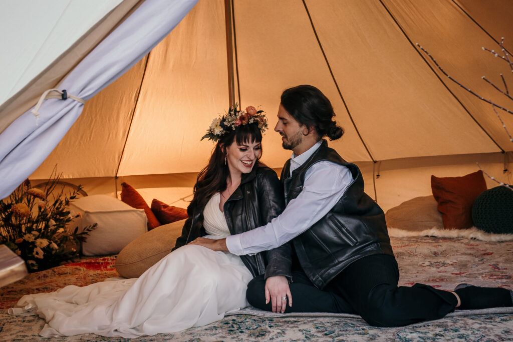 Bride and groom outdoor elopement in tent