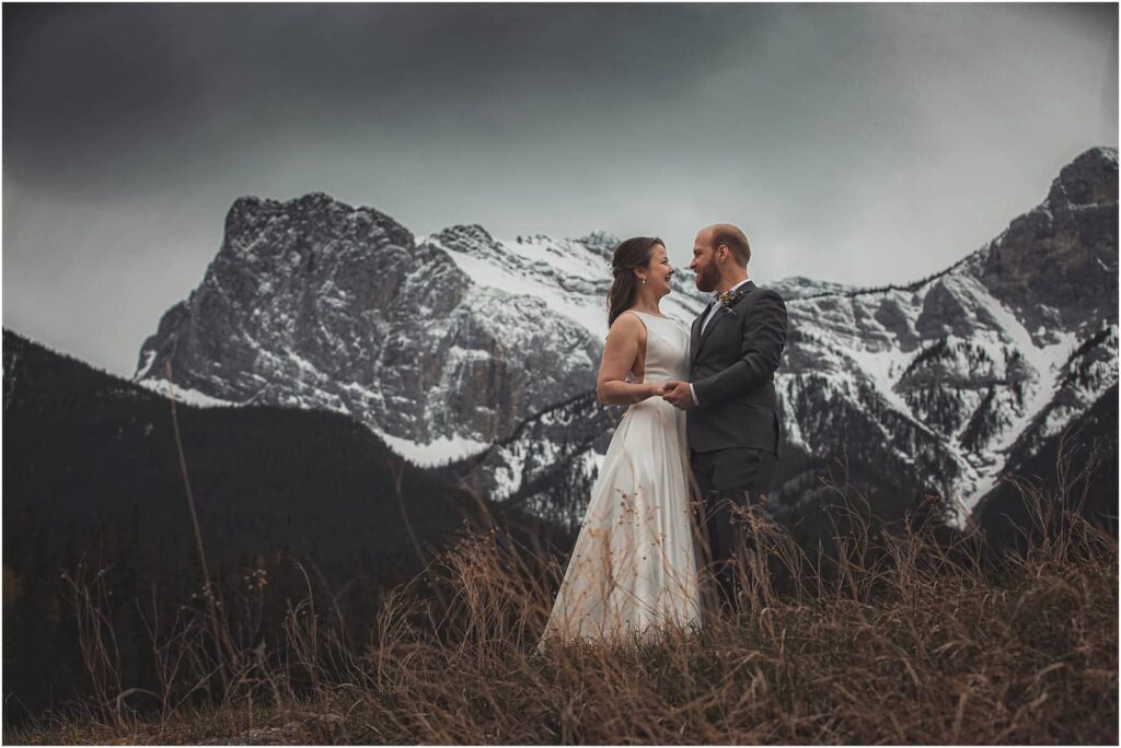 romantic adventure vow renewal with canadian rockies towering in the background