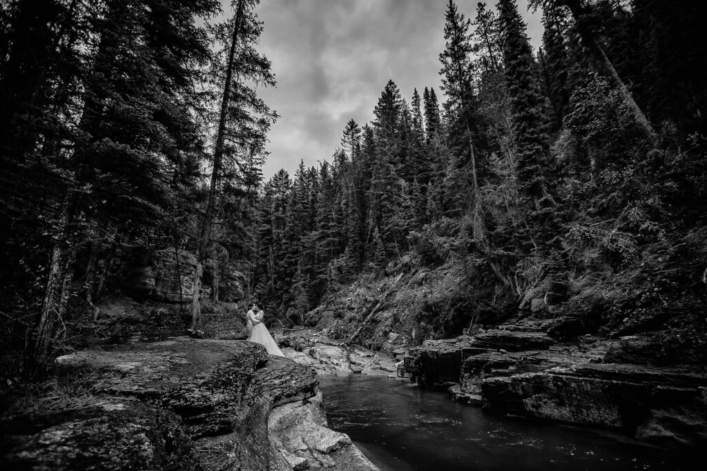 Couple eloping in Jasper National Park surrounded by mountains and wilderness.