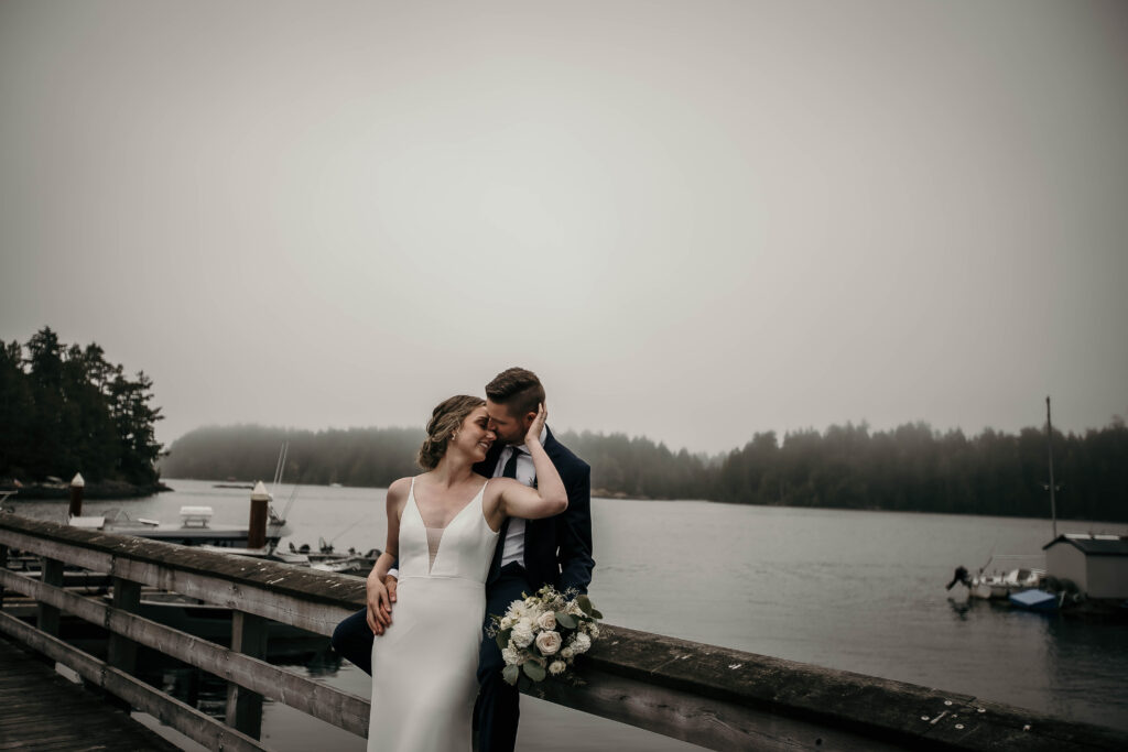 Couple enjoying their elopement in Tofino & Ucluelet with moody weather and Pacific coastal breeze.