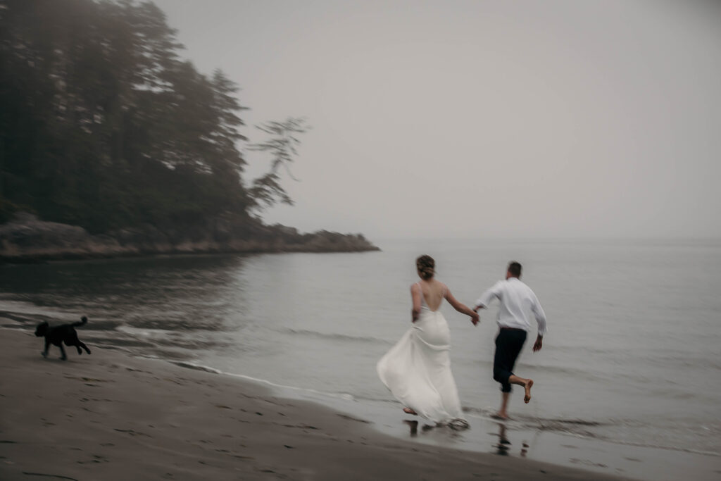 Couple barefoot on the beach during their Tofino or Ucluelet elopement.