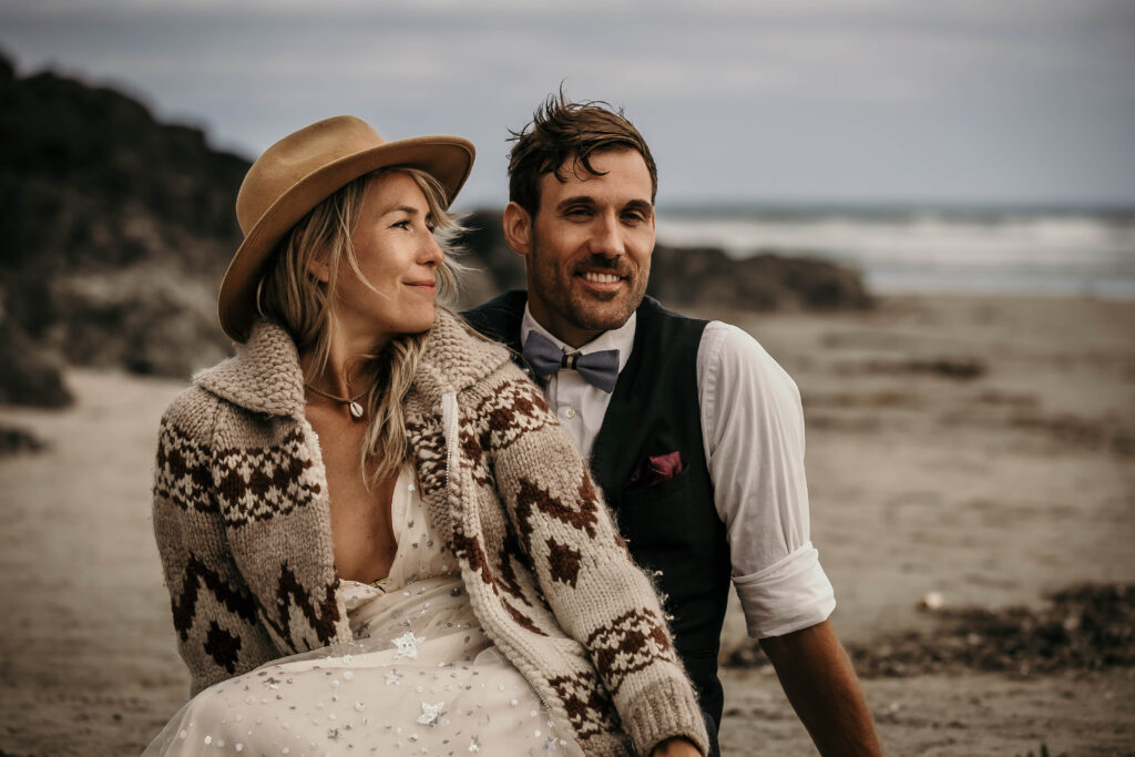 Close-up of weather-ready sweaters and layers worn during a Tofino or Ucluelet elopement.